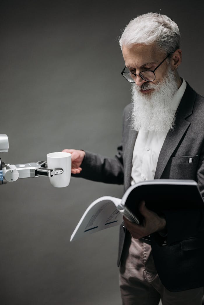 services-img An elderly scientist reads while a robot serves coffee, representing technology's role.